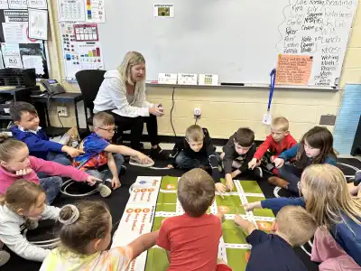 Image of a woman with a group of students